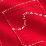 Pantalon enfant en twill rouge, forme légèrement ballon avec poches italiennes